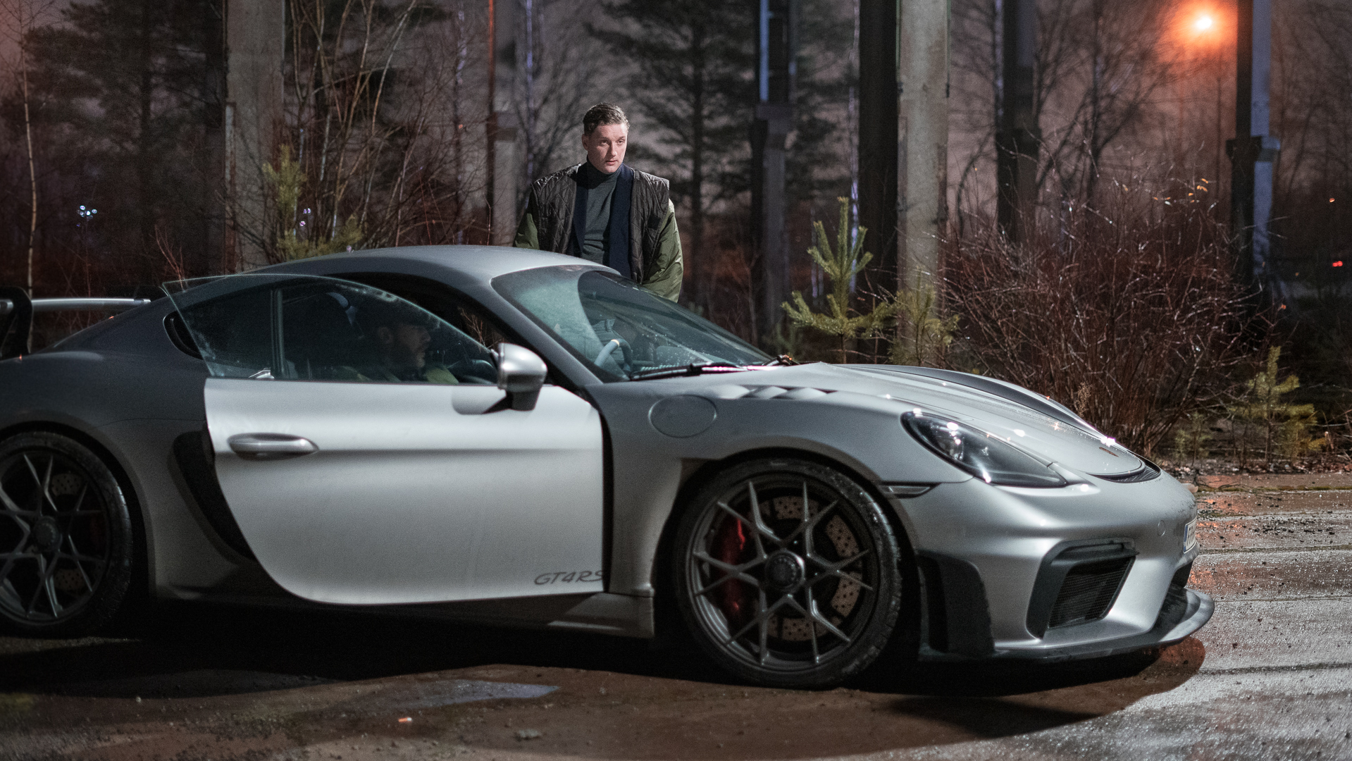 Deception, season 1. Joakim (Elias Gould) (standing next to his car.)